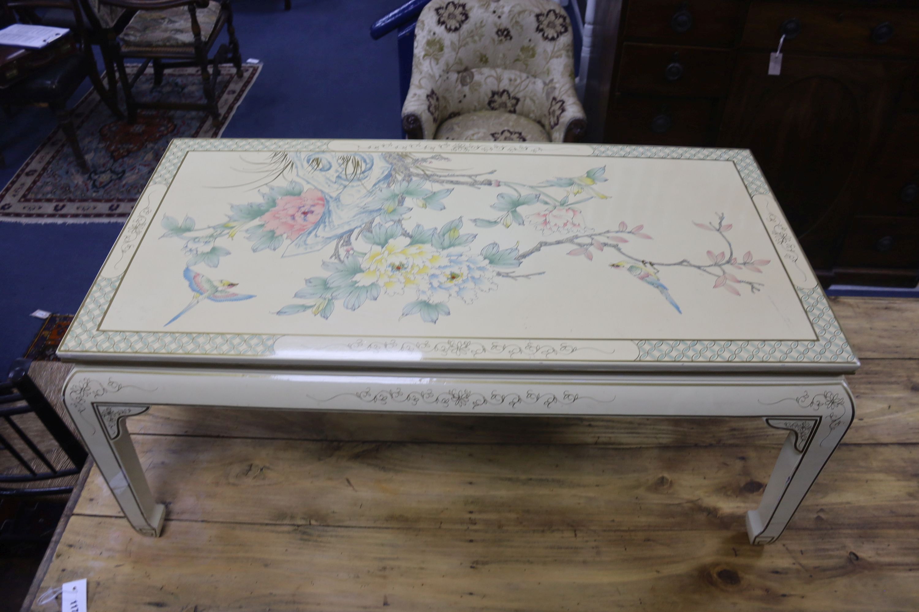 A Chinese black laquer chest of five drawers, a red lacquer chest and a cream lacquer coffee table